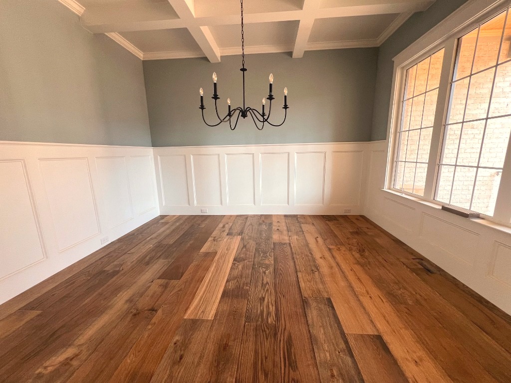 Character hardwood gluedown beneath coffered ceilings by CRG Flooring