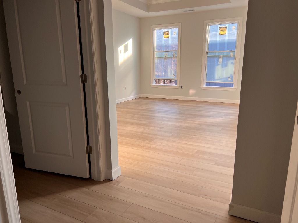 Waterproof luxury vinyl plank LVP flooring and custom LVP stairs sold and installed in Raleigh, NC by CRG Flooring